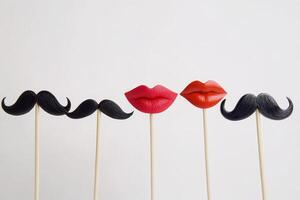 A row of fake mustache and fake lips photo