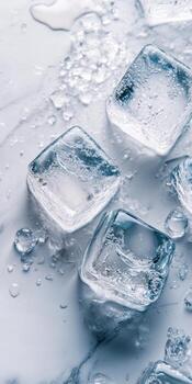A close up of a few ice cubes on a marble counter top photo