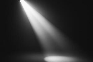 Dramatic Spotlight Illuminating Dark Stage with Intense Beam of Light in Theatrical Setting photo