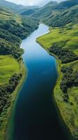 A river with a green forest on either side photo