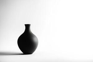 Minimalist Black Ceramic Vase on White Background with Soft Shadows photo