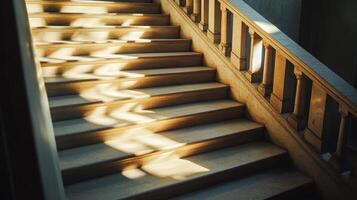 Sunlit Stone Staircase with Elegant Shadows in a Historic Building Interior photo