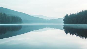 A lake with a reflection of the trees in the water photo