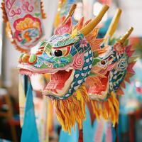 Three dragon masks are displayed in a room, each with a different color scheme photo