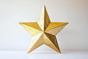Golden Metallic Star Sculpture Against Minimalist White Background photo