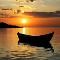 A boat is floating on a calm lake at sunset photo