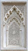 A white archway with a lot of detail photo