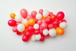 A bunch of balloons in various colors, including white, orange, and pink photo