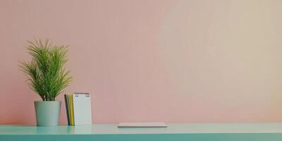 A white notebook sits on a desk next to a potted plant photo