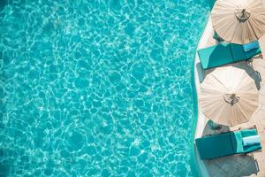 A pool with a blue water and three umbrellas photo