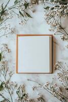 A book is placed on a table with flowers surrounding it photo