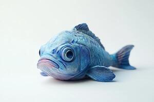 Vibrant Blue Fish Sculpture on White Background photo