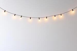 Minimalist String Lights Against a Clean White Wall photo