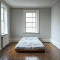 Minimalist Bedroom Interior with Wooden Floor and Large Windows in Natural Light photo