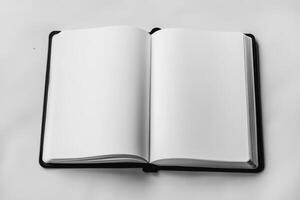 A black book with a white page is open to the middle photo