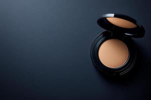 Compact powder and foundation bottle arranged neatly with space for text. photo