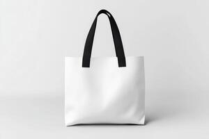 Minimalist White Tote Bag with Black Handles on a Clean White Background photo