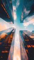 A city skyline with four tall buildings and a blue sky photo