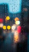 A blurry image of a city street with raindrops on the window photo