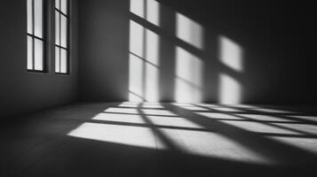A room with a window and a shadow on the floor. The room is empty. The window is open photo