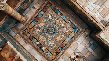 A colorful tile floor with a pattern of squares and triangles. The floor is made of stone and has a gold and blue color scheme photo