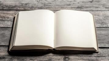 A book is open to a blank page. The book is on a wooden table photo