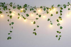 String lights intertwined with green vines create a cozy and inviting ambiance on a minimalist wall. photo