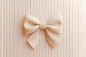 A close up of a beige ribbon bow on a striped background, perfect for minimalist and elegant design themes. photo