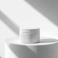 A white jar sits on a white pedestal photo