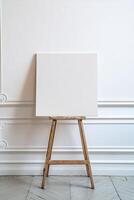 Blank Canvas on Wooden Easel Against Elegant White Wall in Minimalist Art Studio Setting photo