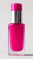 Vibrant Pink Nail Polish Bottle on Simple Background photo