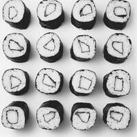 Artistic Arrangement of Sushi Rolls in Black and White Style photo