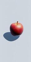 Fresh Red Apple with Shadow on Minimalist Light Blue Background for Modern and Clean Design Concepts photo