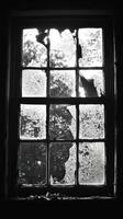Broken Window with Cracked Glass in Abandoned Building photo