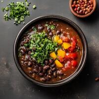 Colorful Bean Soup with Fresh Herbs and Vegetables in a Bowl photo