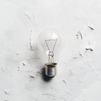 Clear Light Bulb on Textured Background for Creative Projects photo