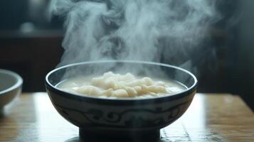 Hot Steamy Bowl of Freshly Cooked Dumplings with Steam Rising photo