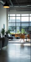 A large open room with a lot of furniture and a window photo