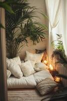 Cozy Indoor Retreat with Soft Cushions and Ambient Candlelight photo