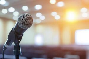 Close-Up of Microphone on Stage with Blurred Background and Warm Lighting photo