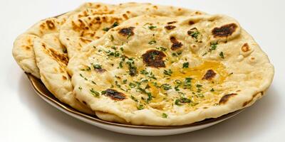Freshly Baked Indian Butter Naan with Herbs on a White Plate photo