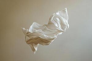 Elegant Flowing Fabric Suspended in Air Against a Neutral Background photo