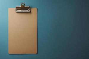 A clipboard is hanging on a wall photo