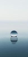 Tranquil Water Droplet Creating Ripples on a Calm Surface photo