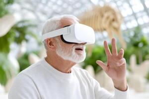 Elderly man engages in immersive experience exploring a virtual museum with VR glasses and hand gestures photo