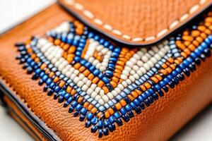 Close-up view of Native American beadwork on a leather pouch showcasing intricate patterns and exceptional craftsmanship photo