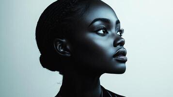 Soft lighting accentuates the graceful features of a woman's profile, creating depth photo