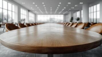An elegant, well-lit conference room with a long wooden table and ample seating photo