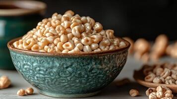 Puffed corn kernels spill from a decorative bowl, inviting a tasting moment photo