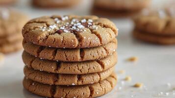 A tempting stack of peanut butter cookies with a sugary topping awaits dessert lovers photo